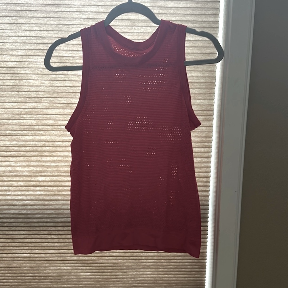 I am selling this because I don’t reach for it and have many more tank tops.